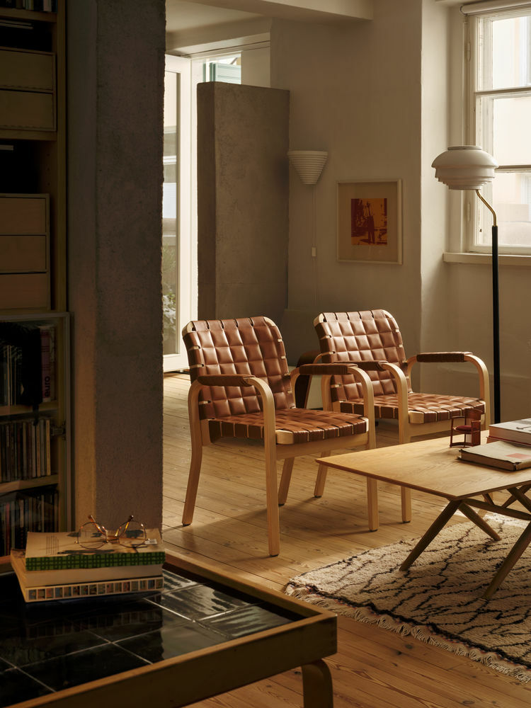 Artek Crafted Through Time in situ armchair 45 walnut elegance leather piping lights off preview